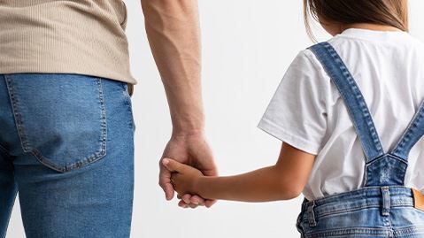father and daughter holding hands